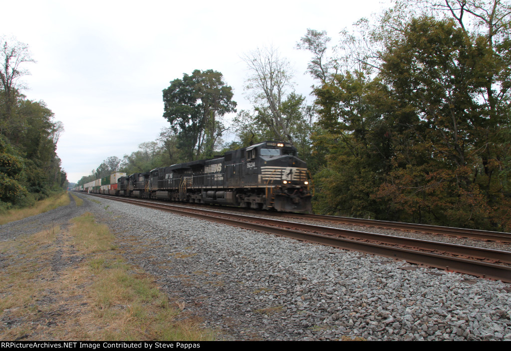 NS 9234 takes an eastbound container train through MP143.5